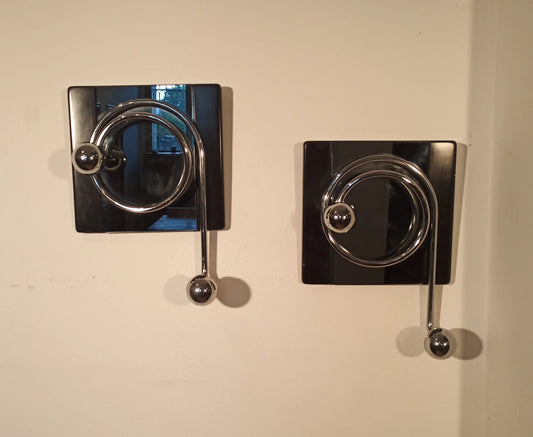 Pair of elegant black wall coat hooks with curved metal hooks, designed by Willy Rizzo in the 1970s.