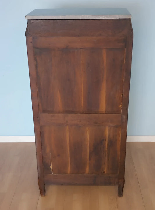 Louis XVI wooden secretary chest of drawers with paneled doors and light marble top from the 19th century