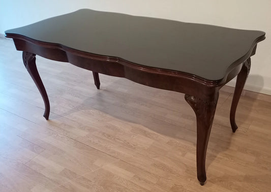 Gorgeous vintage smoked tempered glass Chippendale table with curved legs and scalloped edges in dark wood
