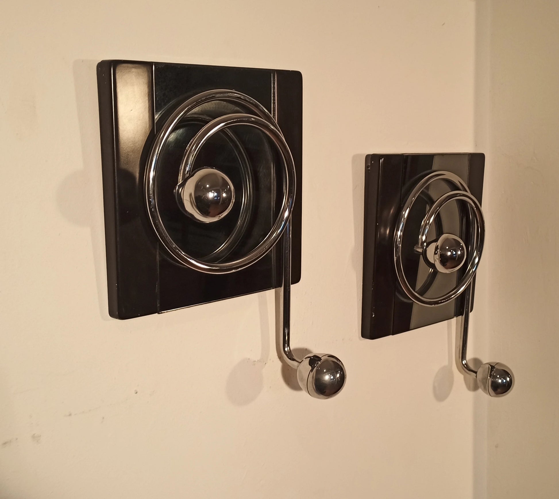 Two elegant black wall coat hooks with spiral design and metal rope by Willy Rizzo from the 1970s.