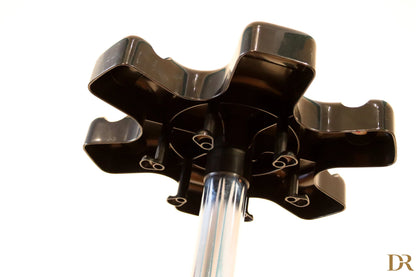 Velca Milano coat rack by Paolo Orlandini with multiple black hooks and a transparent plastic central pole.