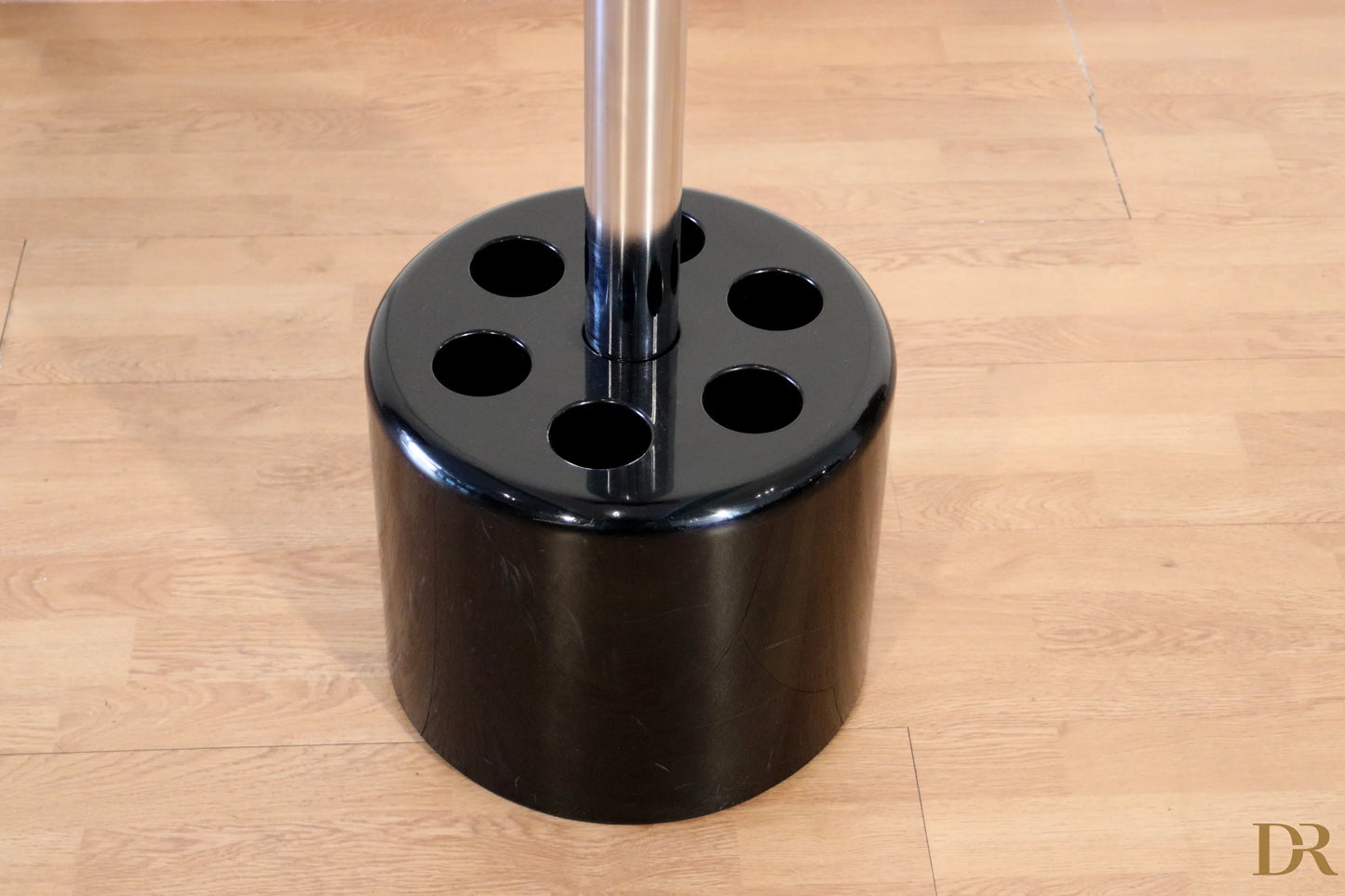 Black cylindrical coat rack and umbrella stand with six circular holes by Paolo Orlandini for Velca Milano