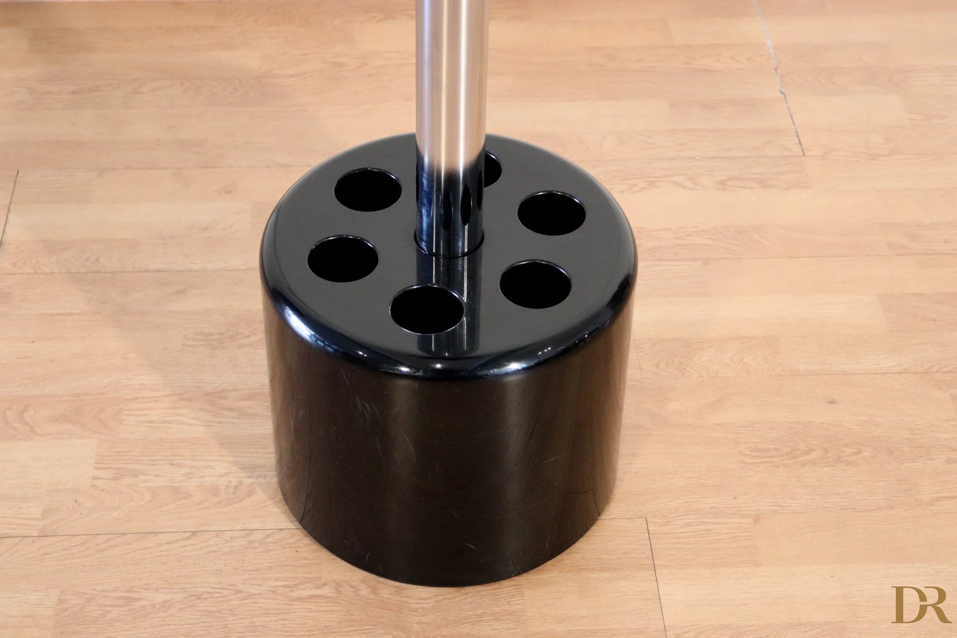 Black cylindrical coat rack and umbrella stand with six circular holes by Paolo Orlandini for Velca Milano
