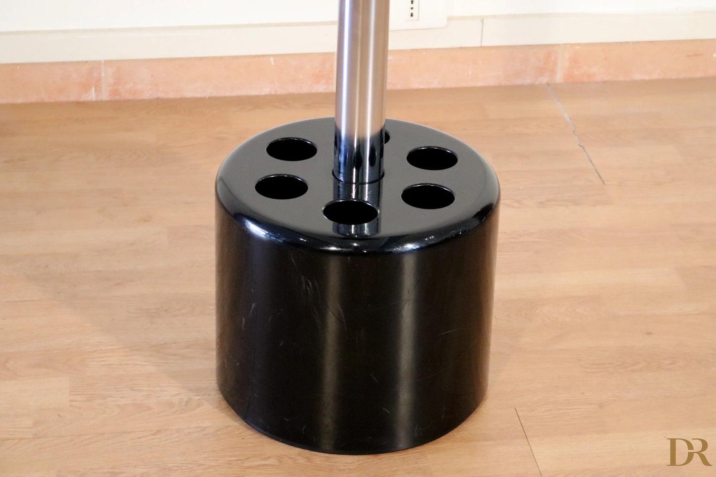 Velca coat stand by Paolo Orlandini and Roberto Lucci, black cylindrical umbrella stand with six umbrella holes.