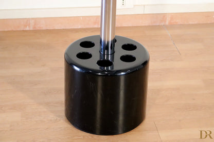 Velca coat stand by Paolo Orlandini and Roberto Lucci, black cylindrical umbrella stand with six umbrella holes.