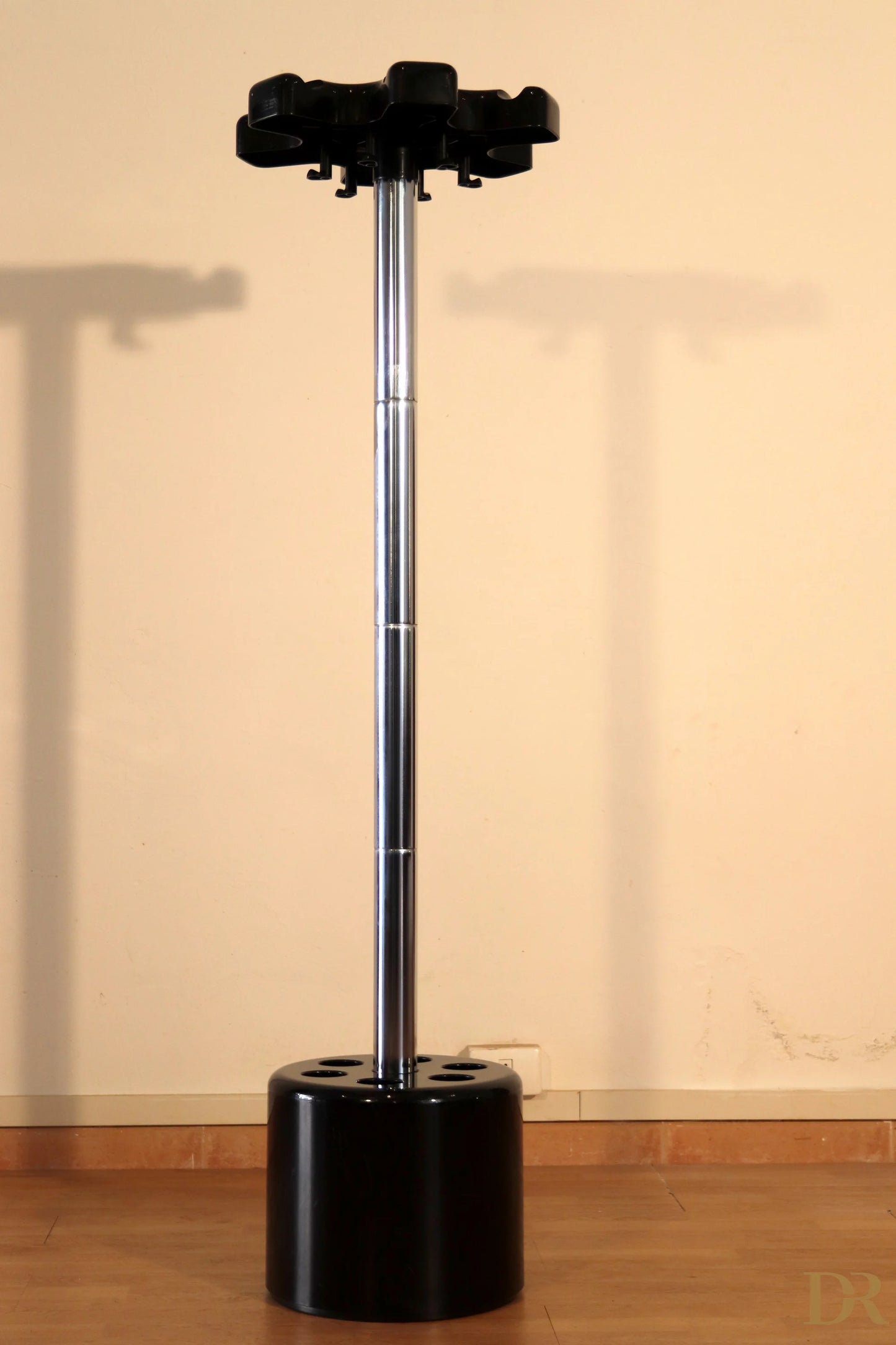 Velca coat stand in black plastic and chromed metal with a circular base by Paolo Orlandini for Velca Milano