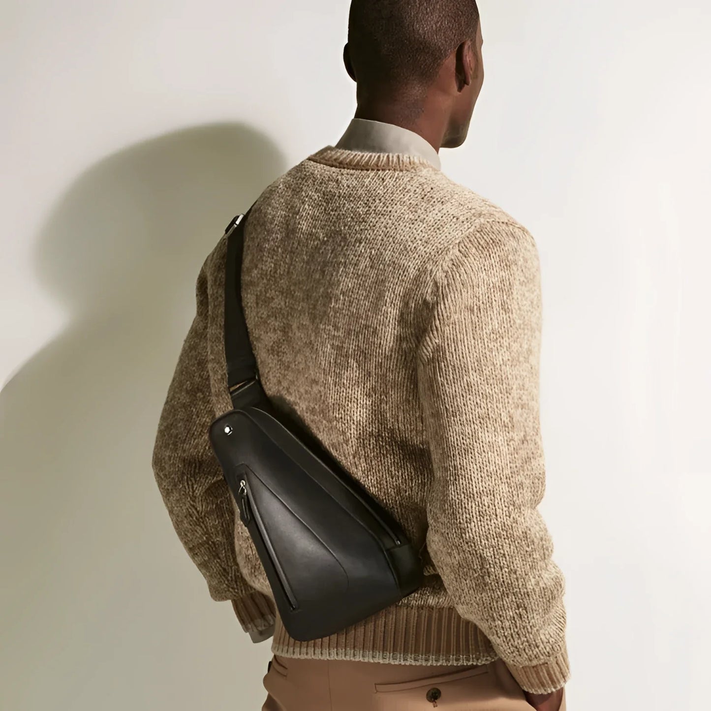 Montblanc Soft Compact Shoulder Bag in Black Leather with a minimal design and external pockets offer elegant practicality