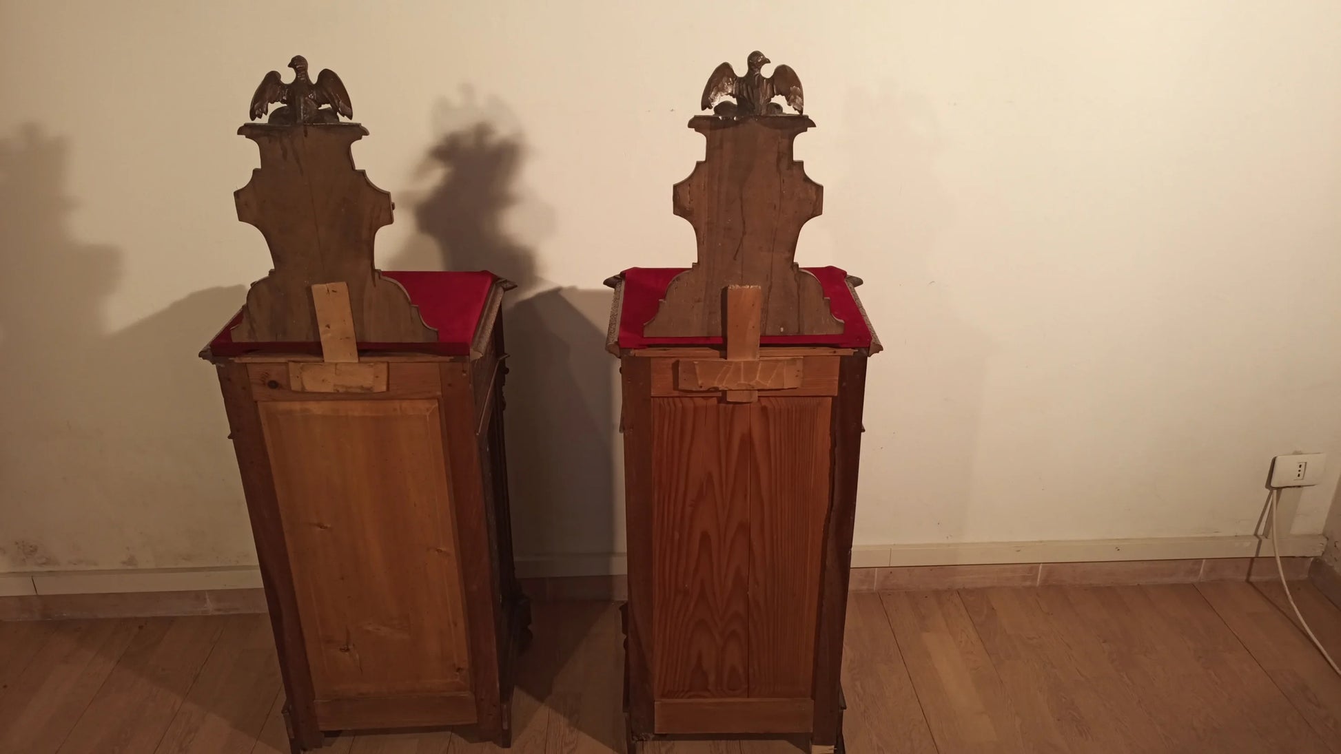 Two wooden chairs with red cushions in the 19th century Italian walnut bedside table and chest of drawers set
