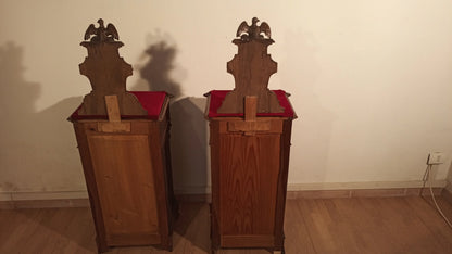 Two wooden chairs with red cushions in the 19th century Italian walnut bedside table and chest of drawers set