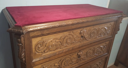 Italian walnut chest of drawers with ornate carvings and red top in a set of 3 bedside tables and chest of drawers 19th century