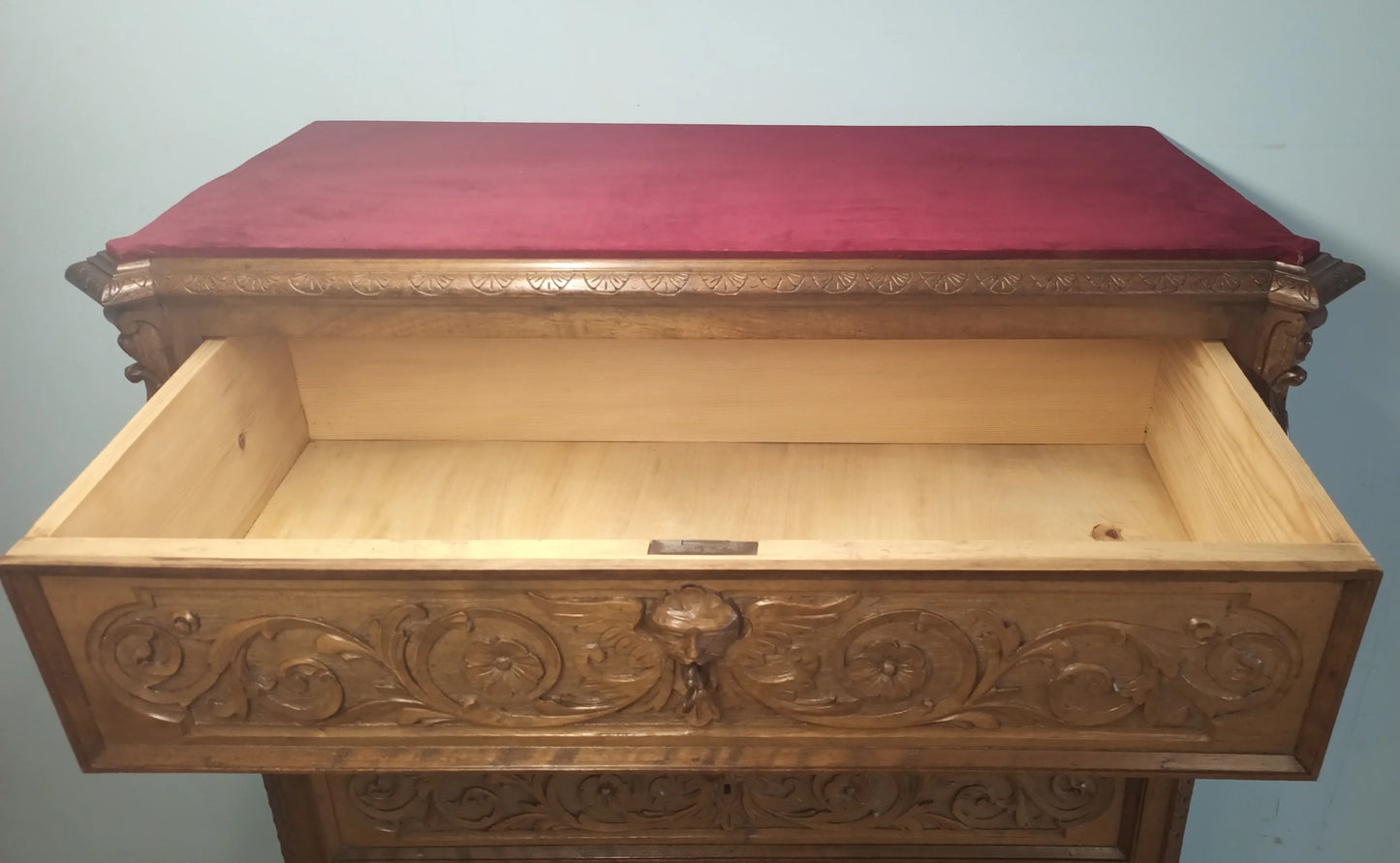 19th century Italian walnut chest of drawers with ornate carvings, red cushion and open drawer set of 3