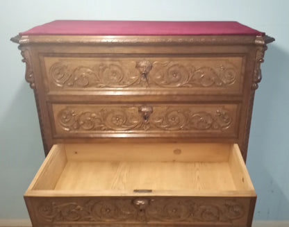 Italian walnut three-drawer canoniera with decorative carved panels in a 19th century bedside table and chest of drawers set