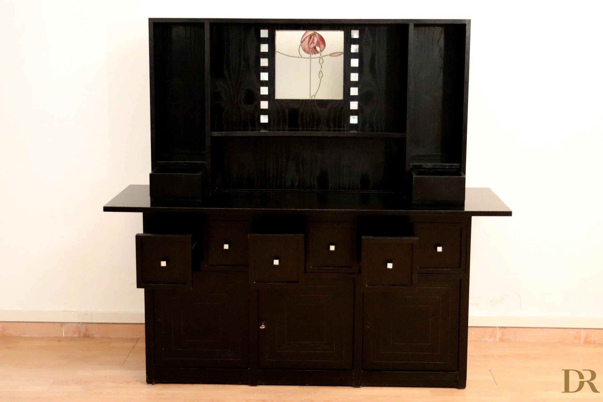 DS5 sideboard by Charles Rennie Mackintosh for Cassina, 1990s, in black lacquer with central panel in Art Nouveau floral decorated glass.