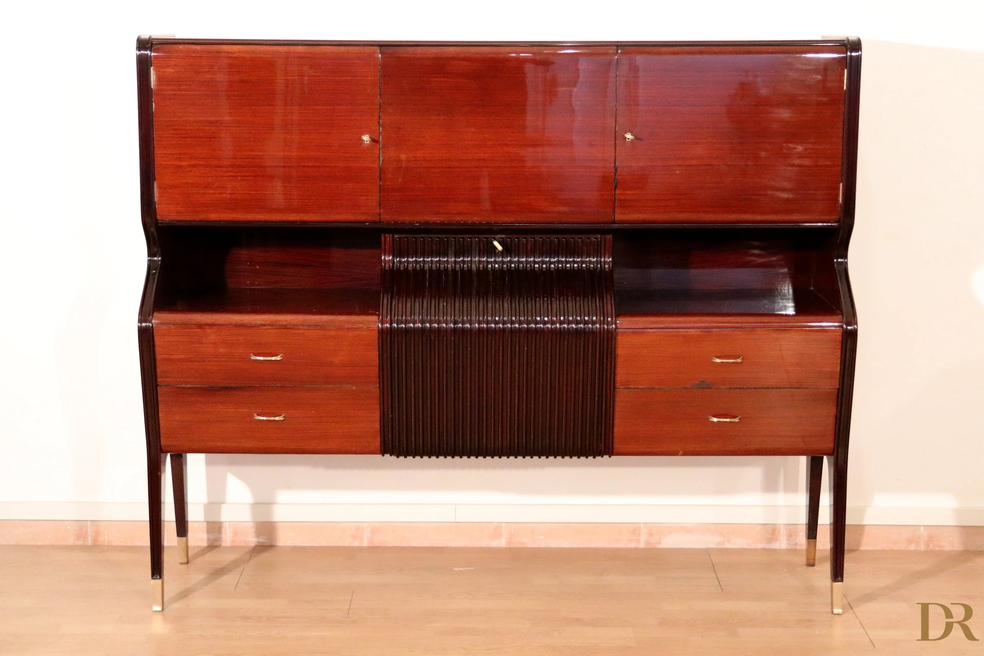 Mid-century sideboard by Osvaldo Borsani in polished mahogany with upper doors and central slatted panel, Italy, 1950s