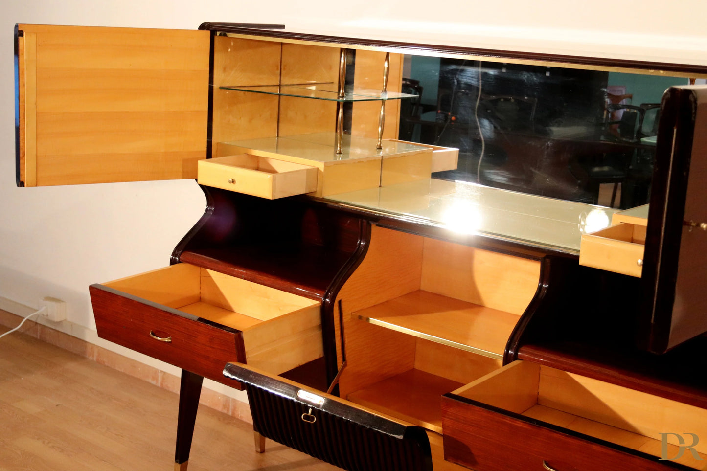 Mid-century sideboard by Osvaldo Borsani in mahogany and rosewood with mirrored top and open drawers elegant glass design