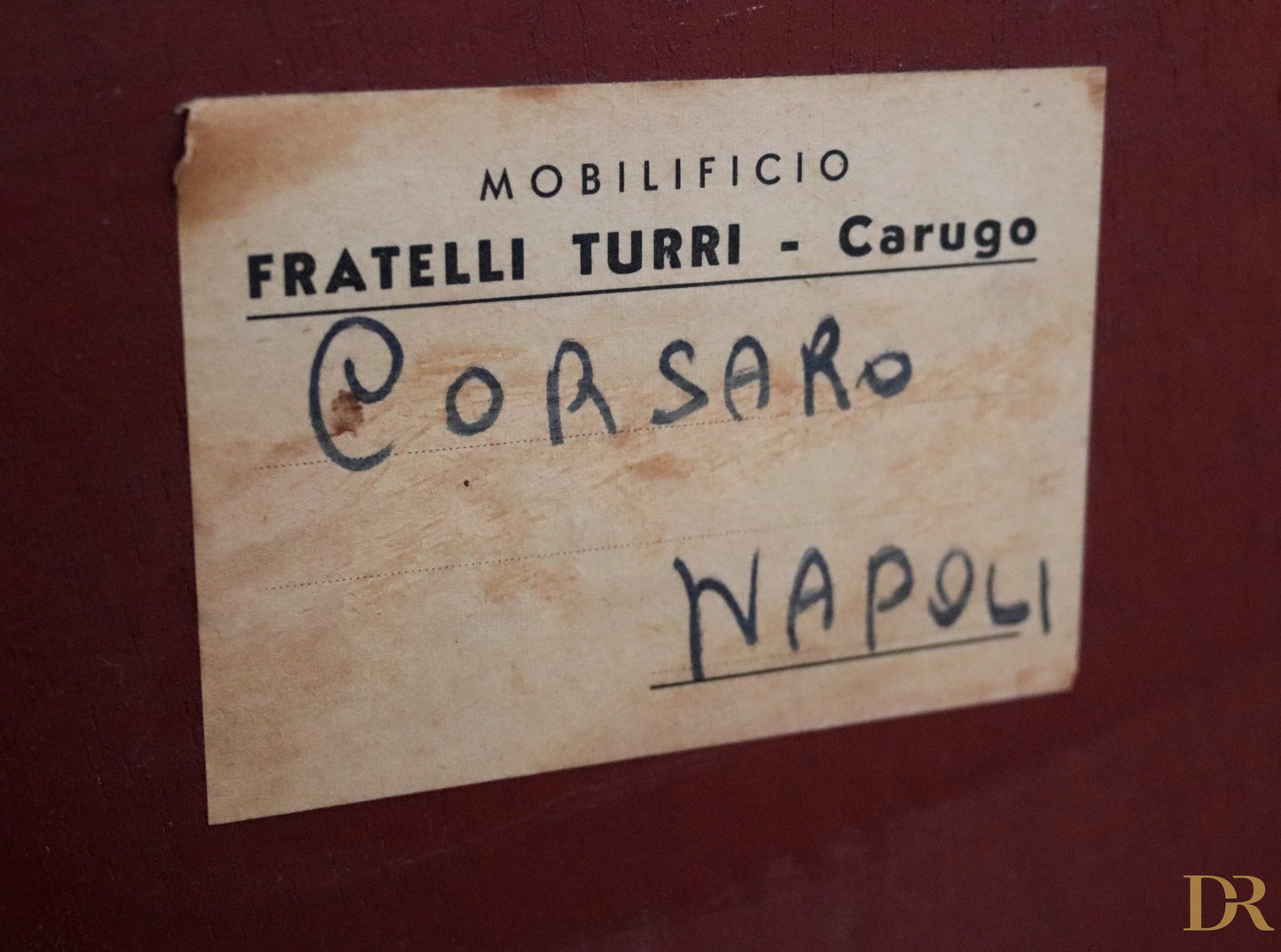Vintage label on the back of a mid-century Osvaldo Borsani sideboard in mahogany, rosewood, and maple, Italy, 1950s.