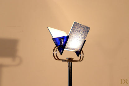 Vintage Arteluce Triana floor lamp with brass metal structure and blue and silver glass signed by the award-winning duo Perry