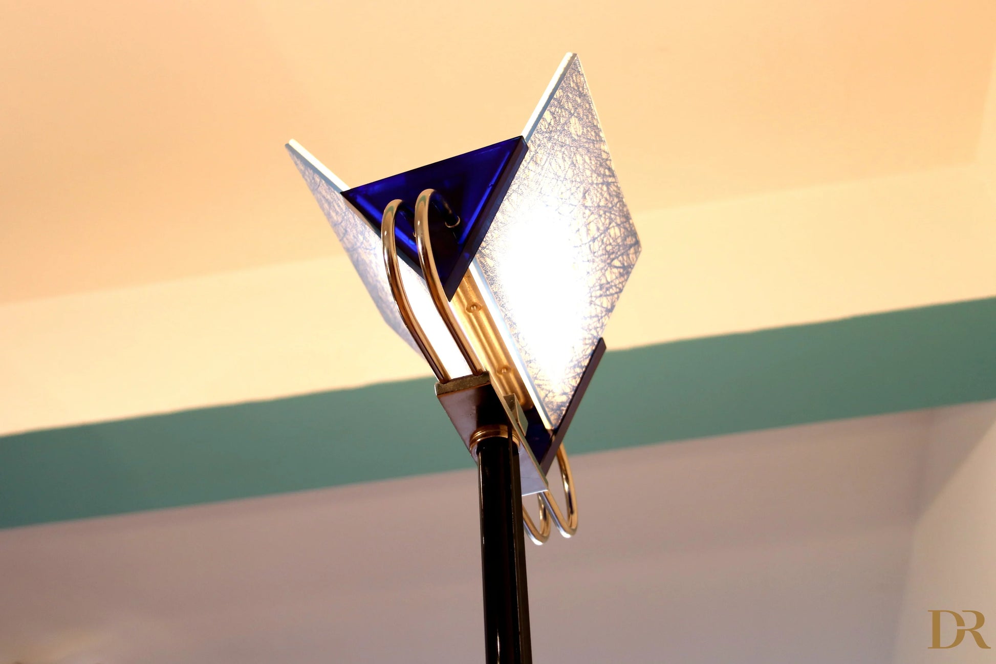 Arteluce Triana vintage floor lamp with black pole, gold metal details and triangular lampshades in blue and opaque white glass