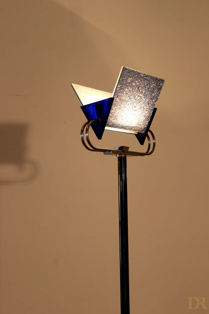 Arteluce Triana vintage floor lamp with black base and geometric shade in blue glass and silver satin glass