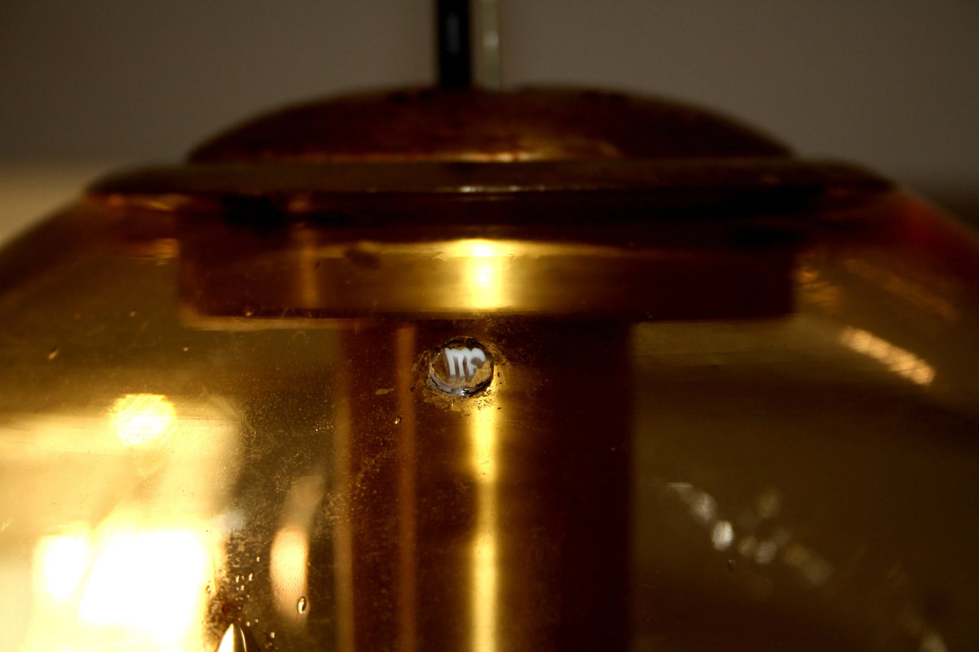 Italian design amber glass pendant lamp with spherical pendant and brass, signed Italy, 1970s