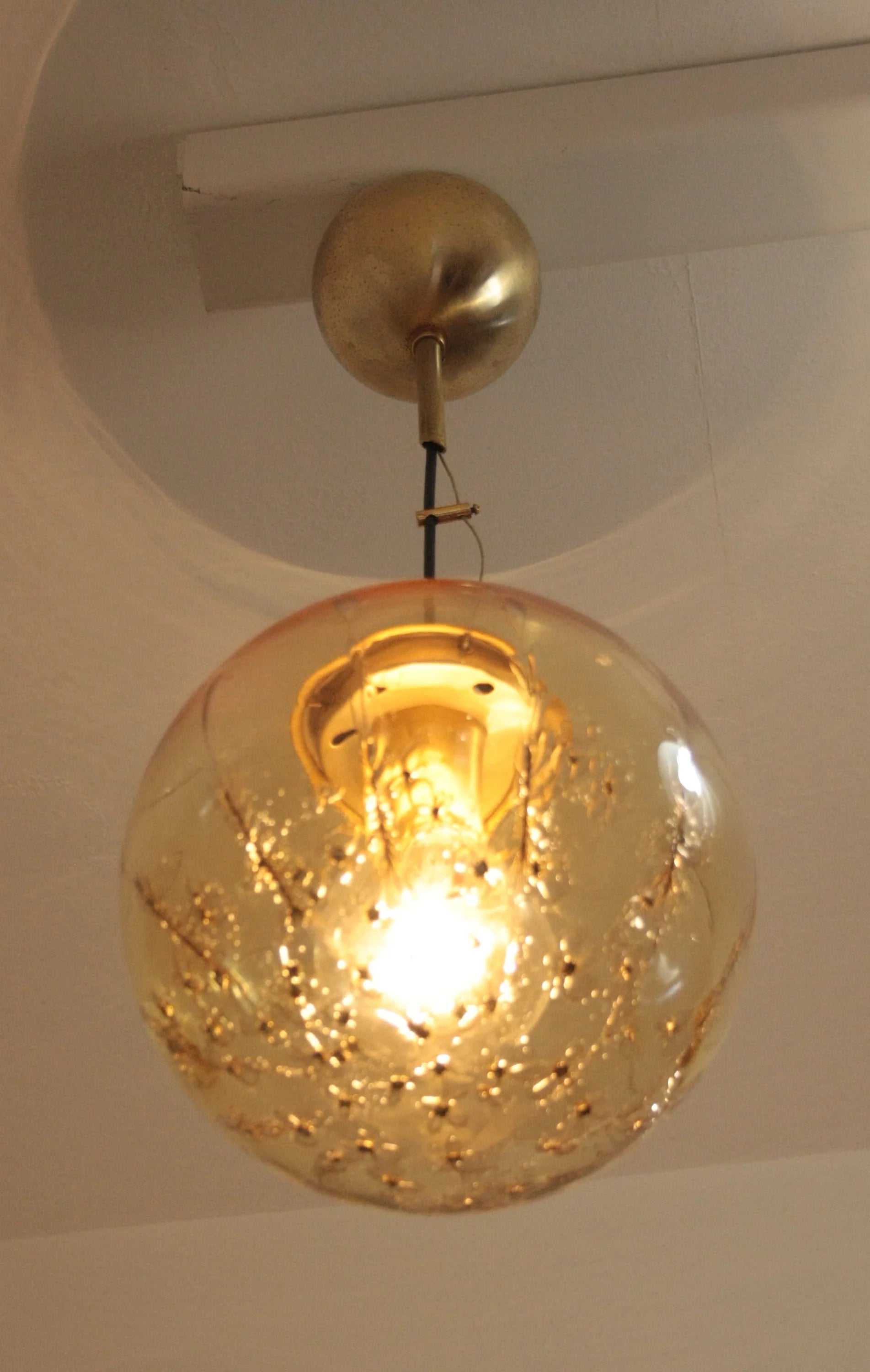 Pendant lamp in golden glass with spherical pendant and brass signed Italian design from the 70s