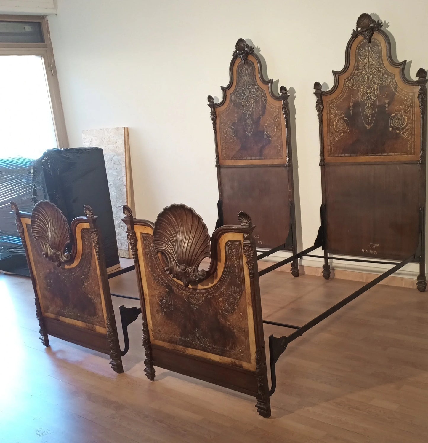 19th century Italian wrought iron bed with decorated wooden frame and mother-of-pearl inlays for the elegant home