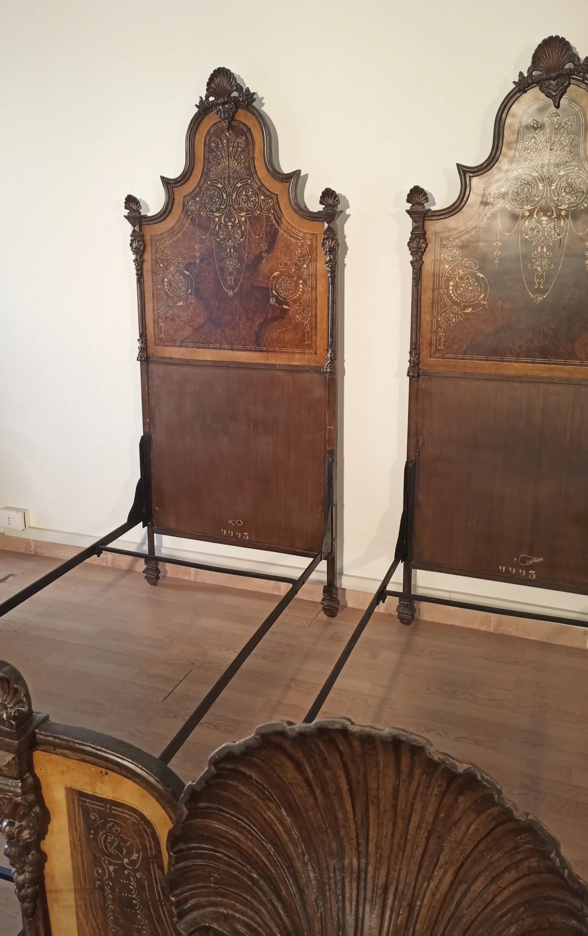 19th century Italian wrought iron bed with carved dark wood headboard and decorative details for home