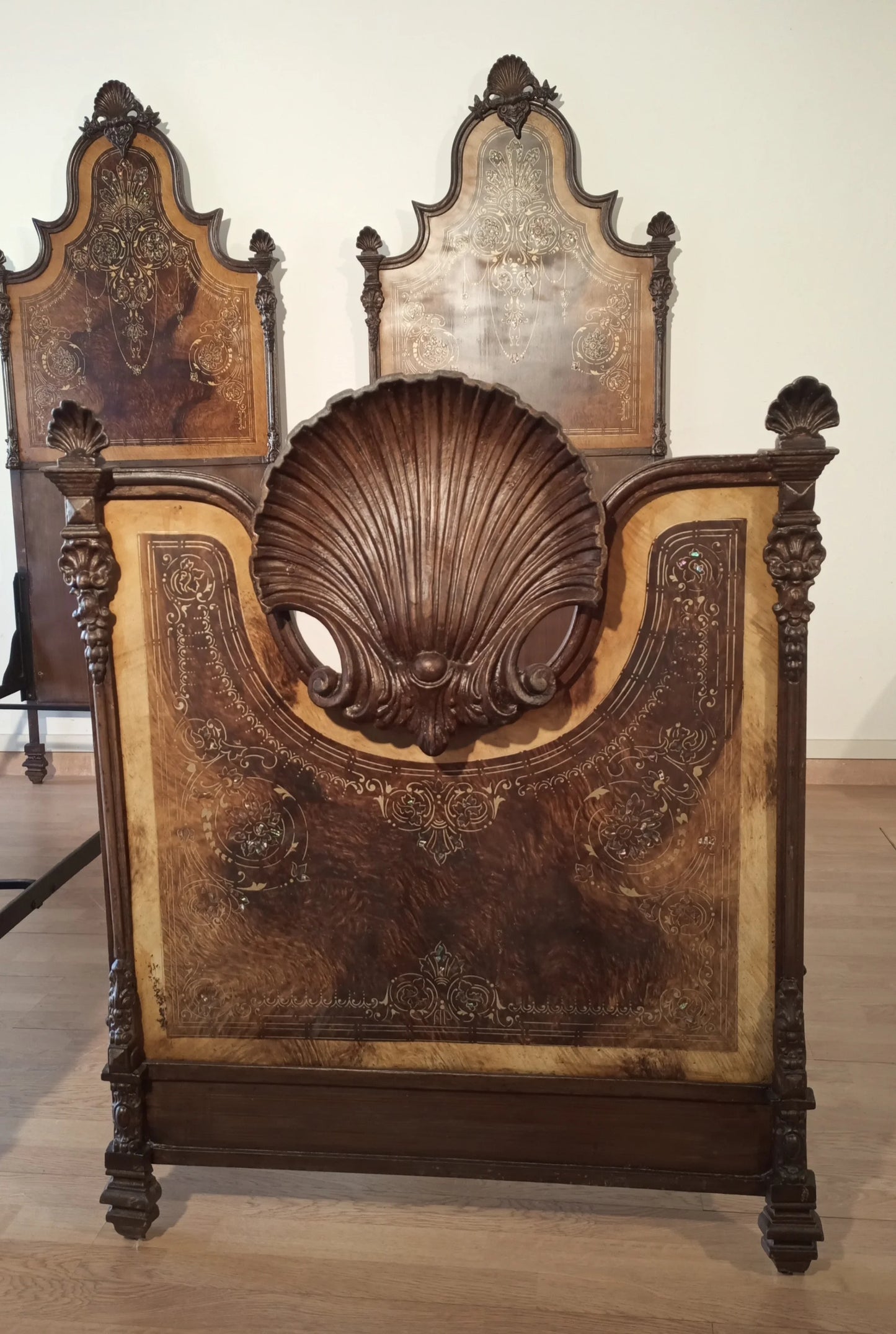 19th century Italian wrought iron bed with Victorian patterned headboard in elegant home