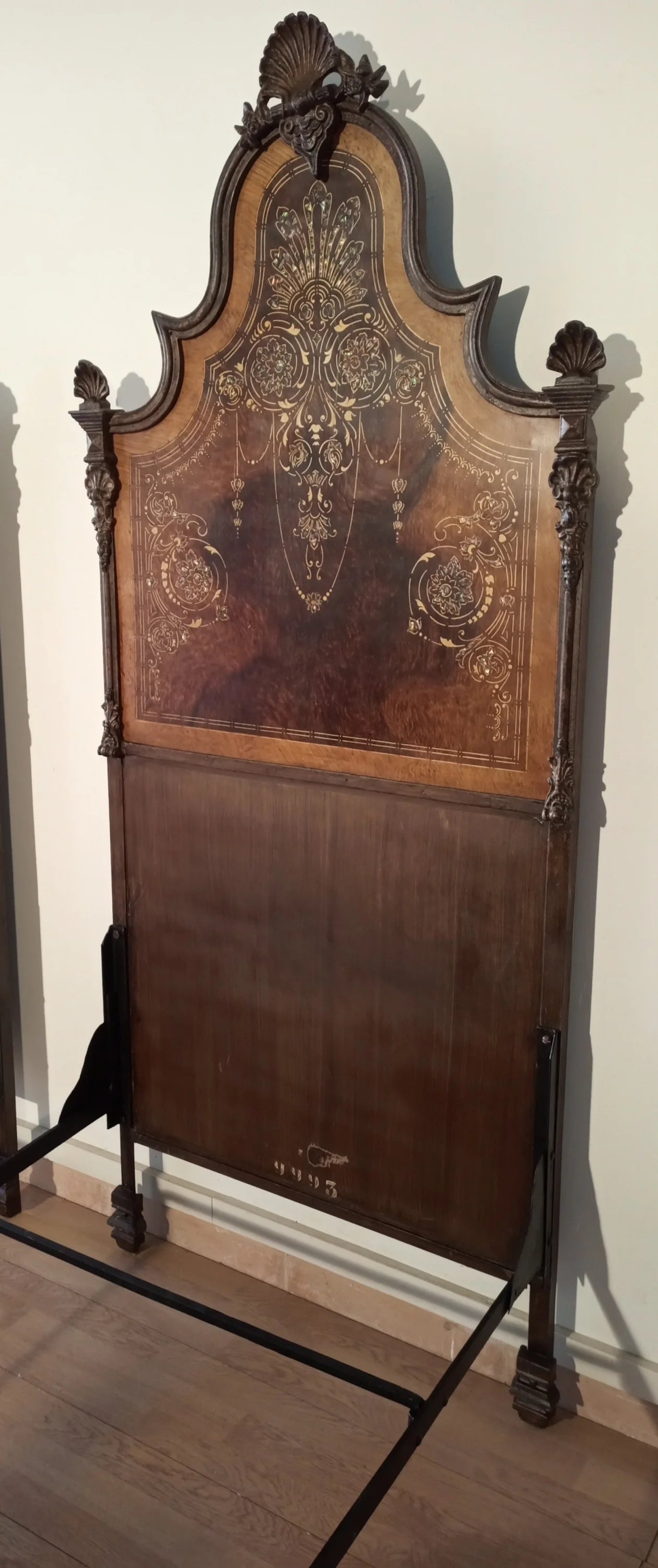 19th century Italian wrought iron bed decorated with mother-of-pearl and faux wood for an elegant home