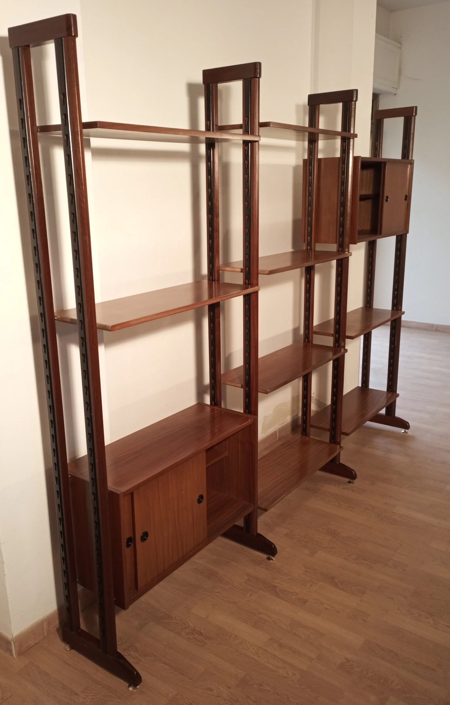 Original Italian 1960s modular teak bookcase with vertical uprights and open compartments