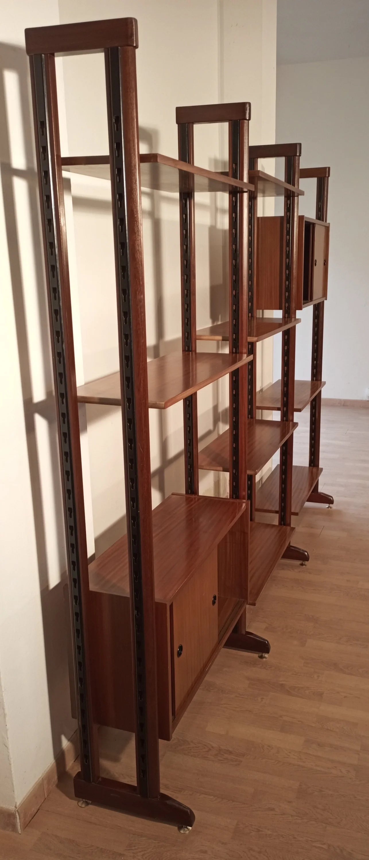 Original vintage modular teak bookcase with vertical supports and horizontal shelves, 1960s design, Italy