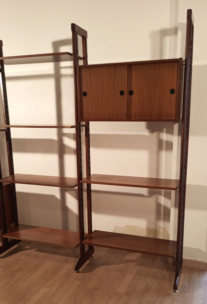 Original 1960s Italian modular teak bookcase with adjustable shelves and mid-century modern wooden door