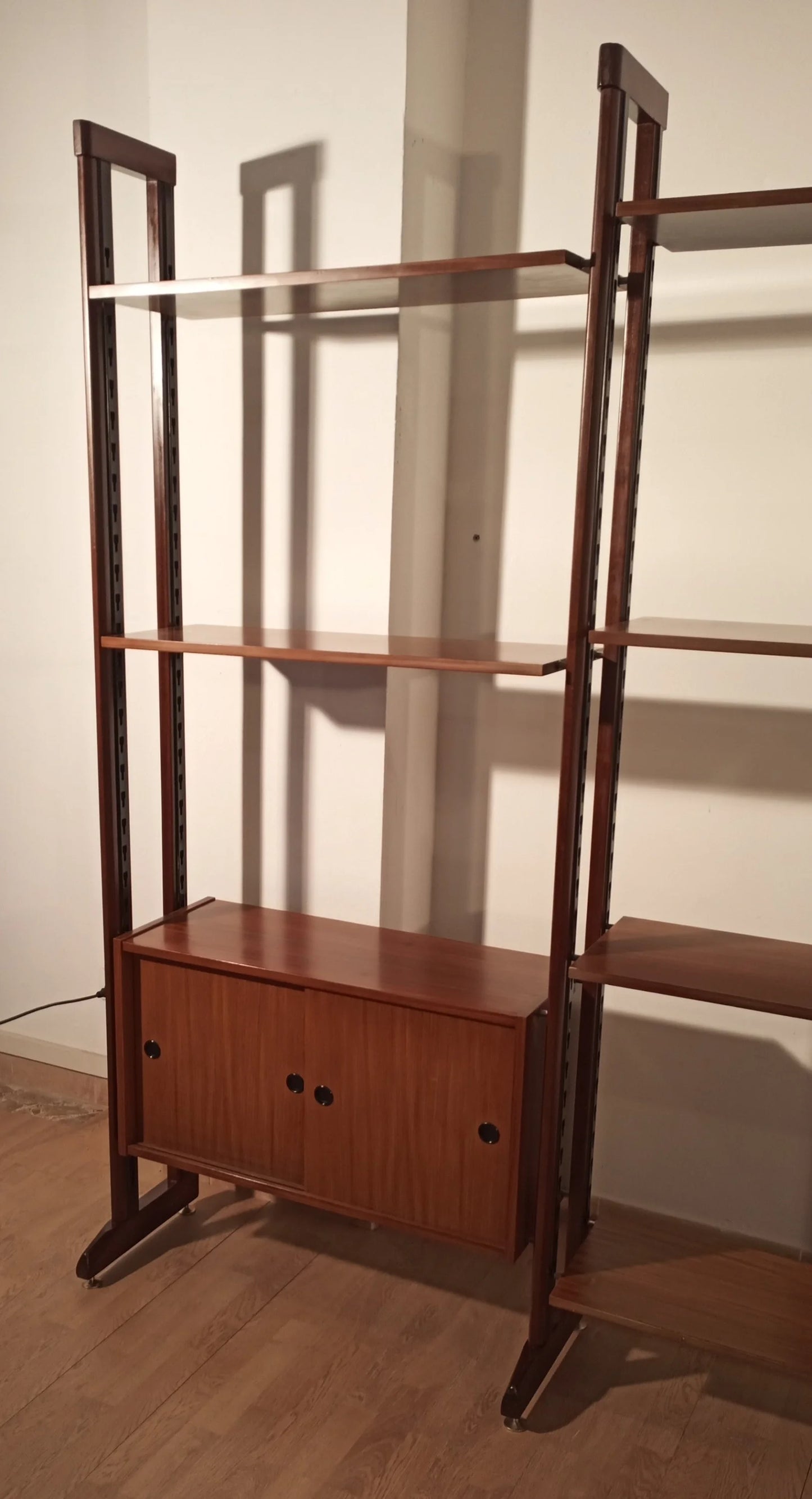 Original vintage modular teak bookcase with dark uprights and base with 1960s Italian cabinet