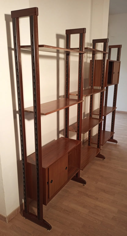 Vintage modular teak bookcase with vertical supports and door compartments, original 1960s modular bookcase