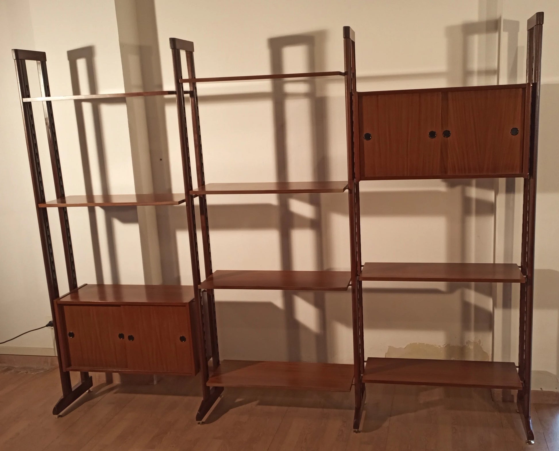 Original 1960s vintage modular teak bookcase with two door compartments in mid-century modern style
