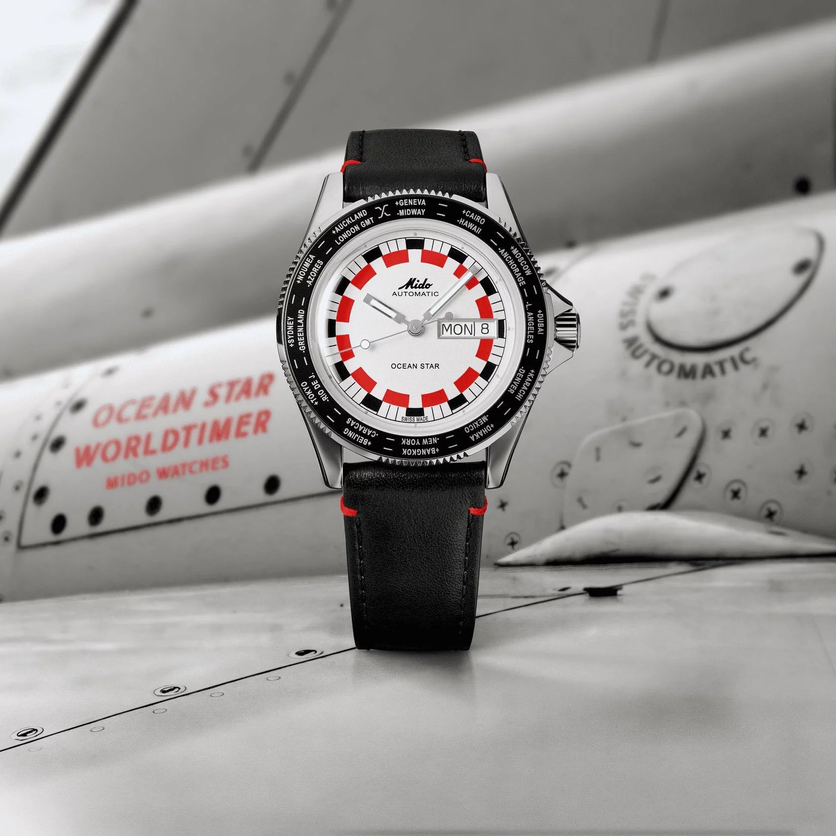 Mido Ocean Star Worldtimer 40mm silver watch with white dial and black leather strap with red stitching