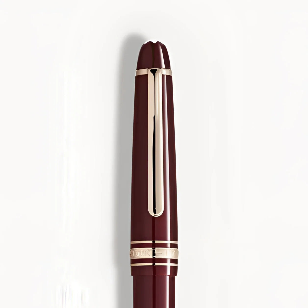 Montblanc Meisterst�ck Classique Bordeaux Rollerball Pen with gold-plated finish and refined metallic clip in deep Bordeaux color.