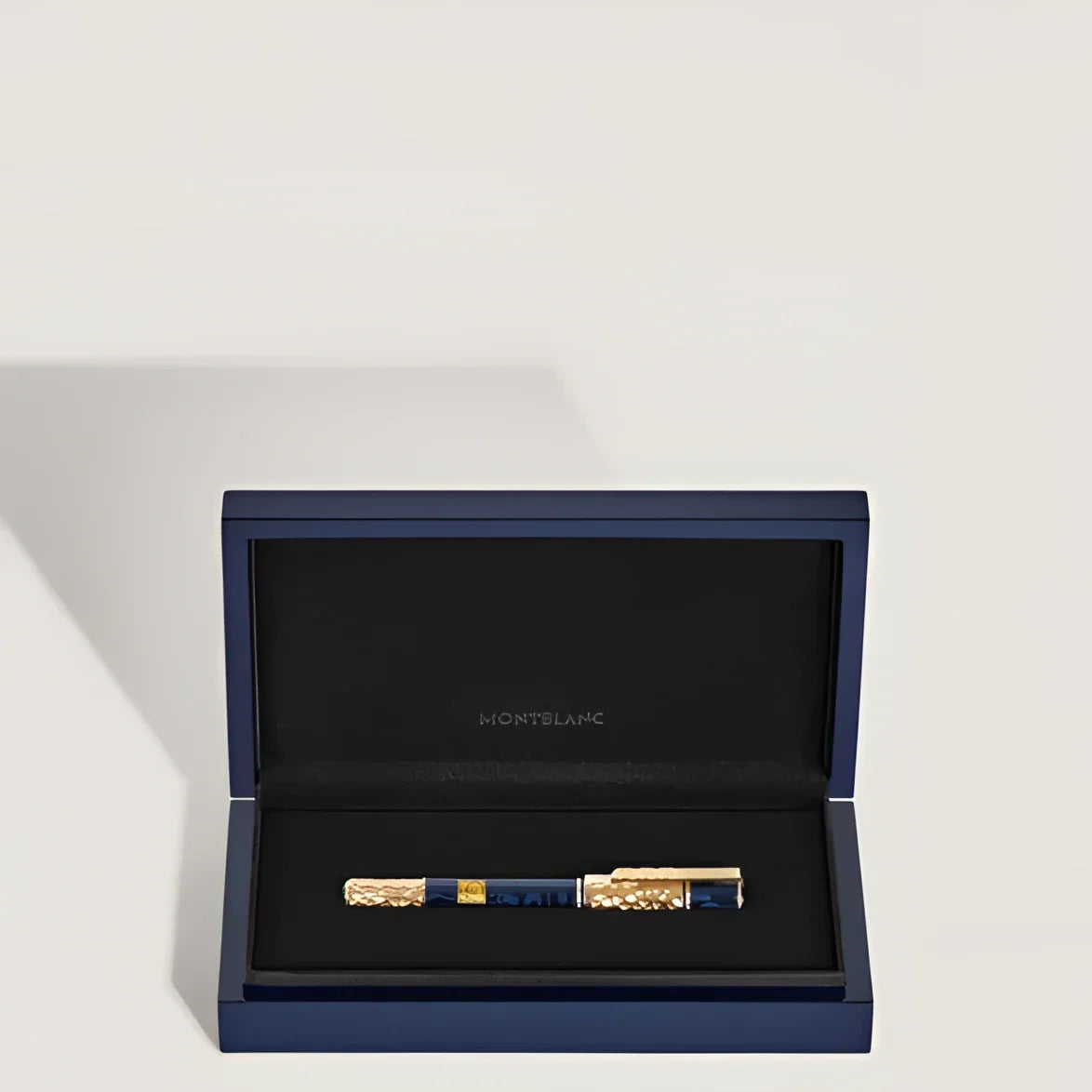 Montblanc Masters of Art Homage to Gustav Klimt fountain pen with deep blue barrel and gold-plated details in navy blue packaging.