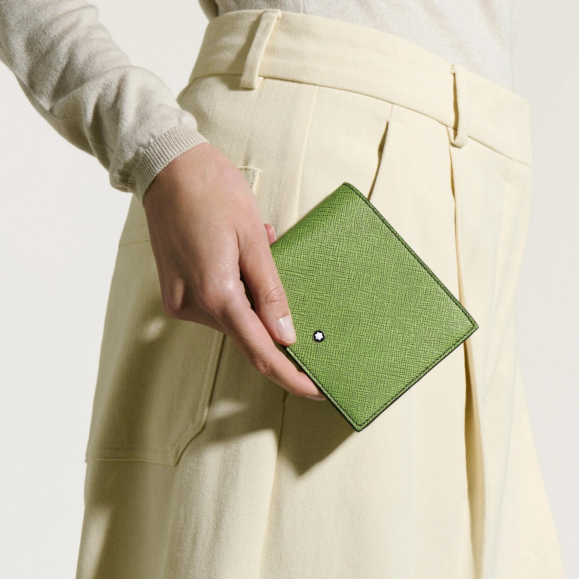 Montblanc 8cc sartorial wallet in multi-lime saffiano-print leather with circular black emblem on the front