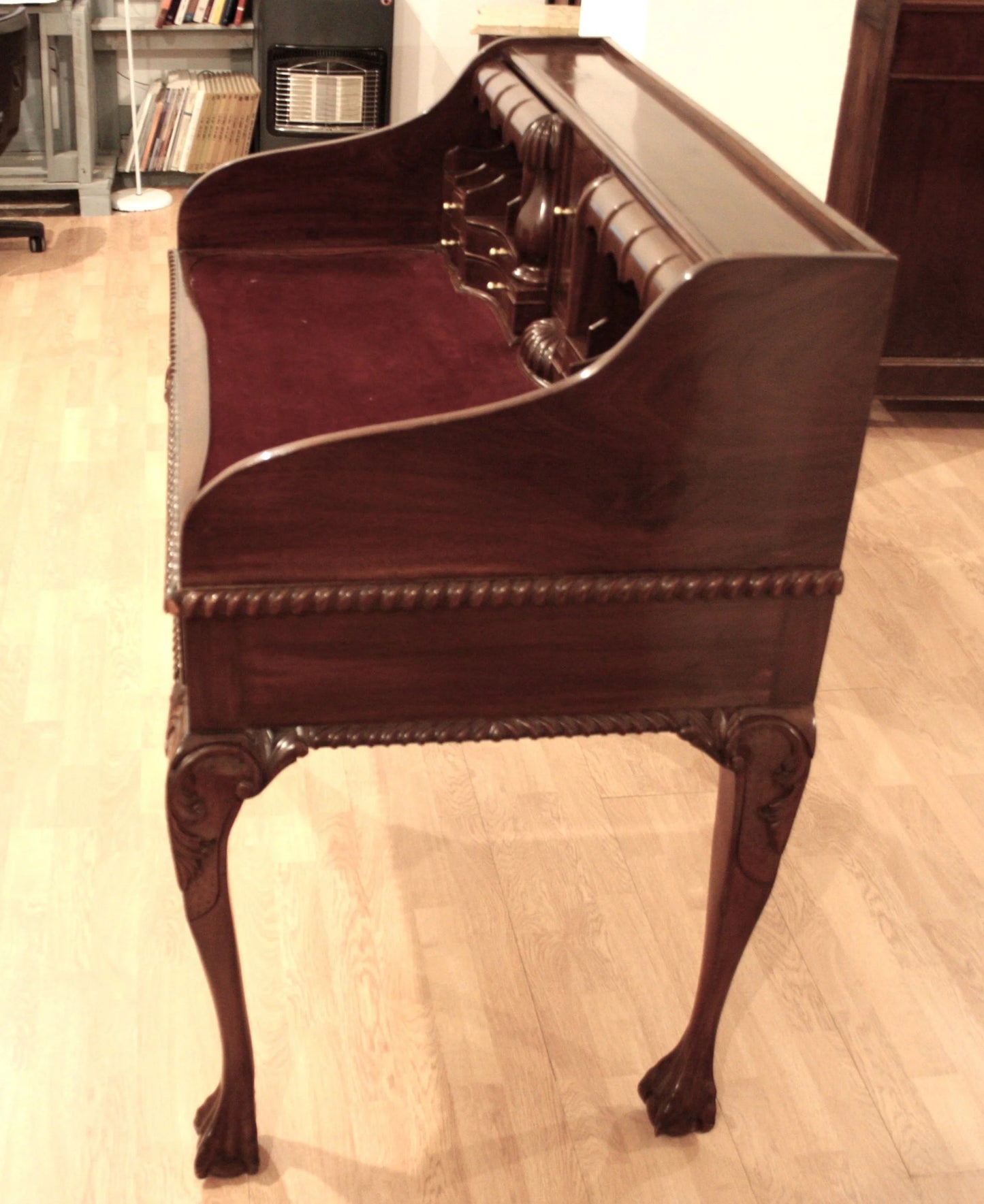 Antique English Chippendale style walnut writing desk with arched legs and claw feet