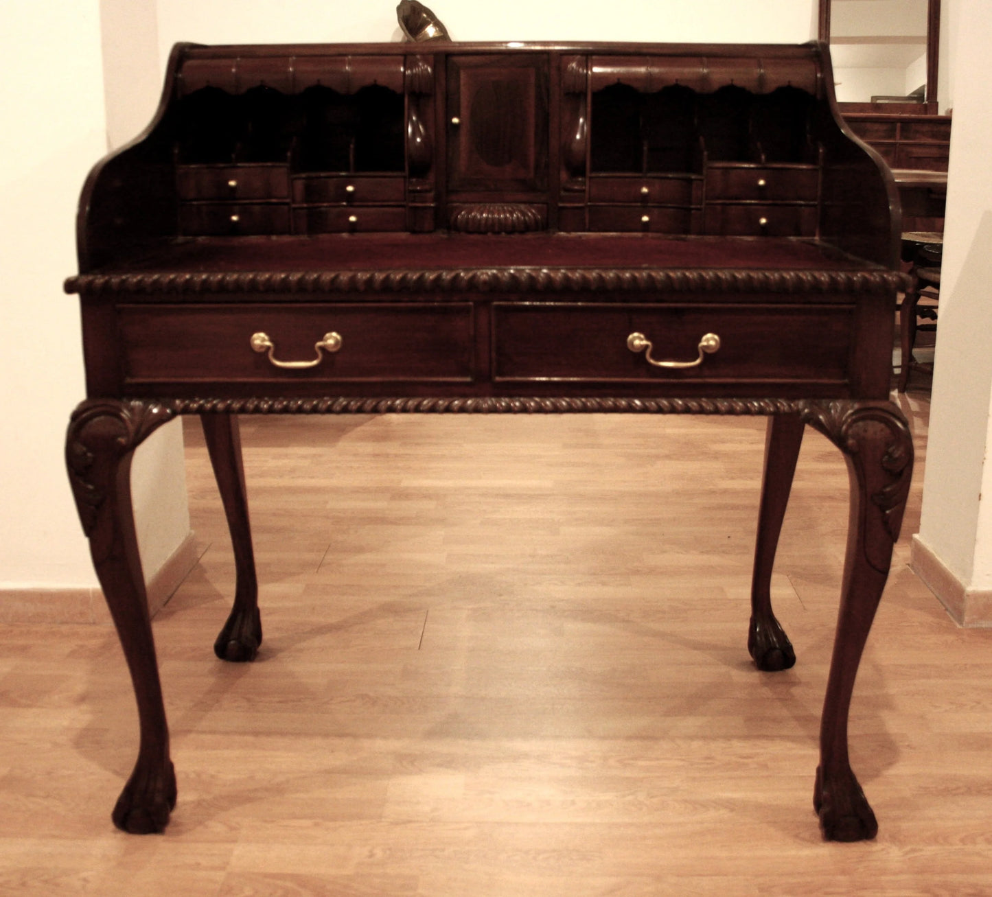 Antique English Chippendale style walnut writing desk with arched legs and claw feet