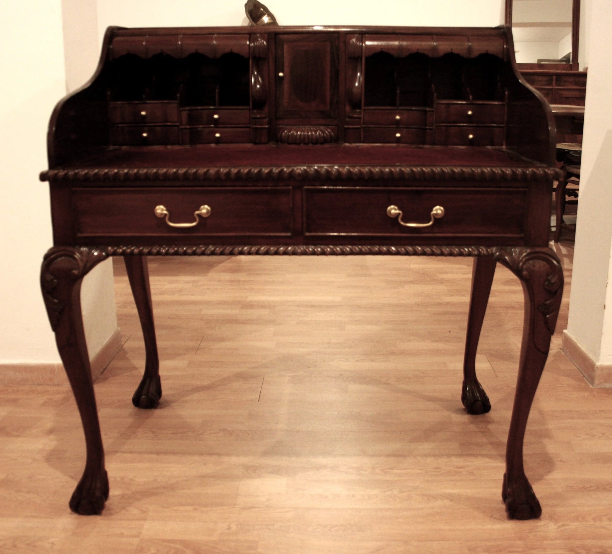 Antique English Chippendale style walnut writing desk with arched legs and claw feet