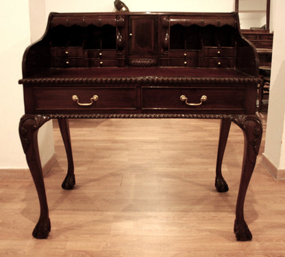 Antique English Chippendale style walnut writing desk with arched legs and claw feet