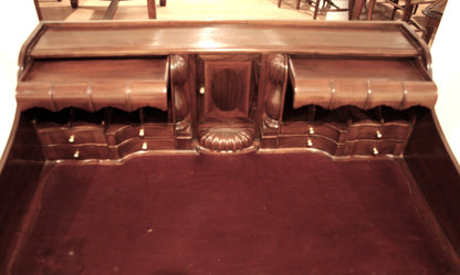 Ornate English Chippendale style walnut office desk with secretaire and arched legs decorated in wood