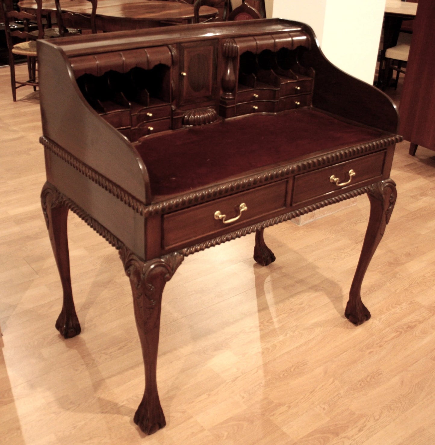 Ornate English Chippendale style walnut office desk with arched legs and brass hardware