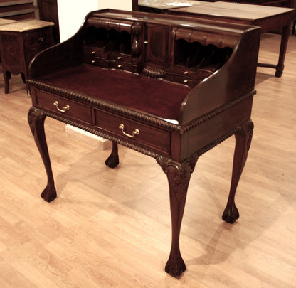 English Chippendale style walnut office desk with arched legs and ornate brass hardware