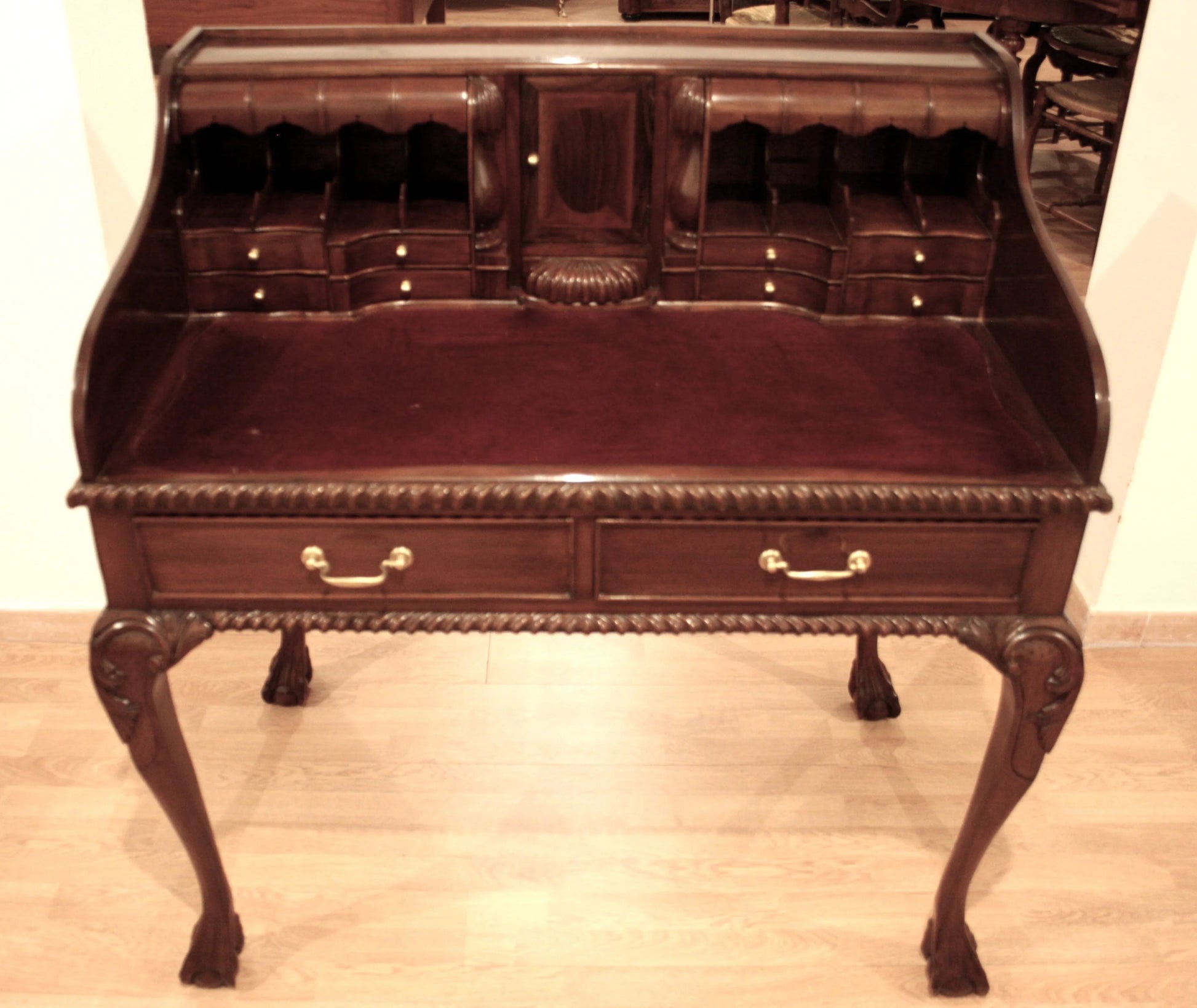 Ornate English Chippendale style walnut office desk with arched legs and numerous drawers