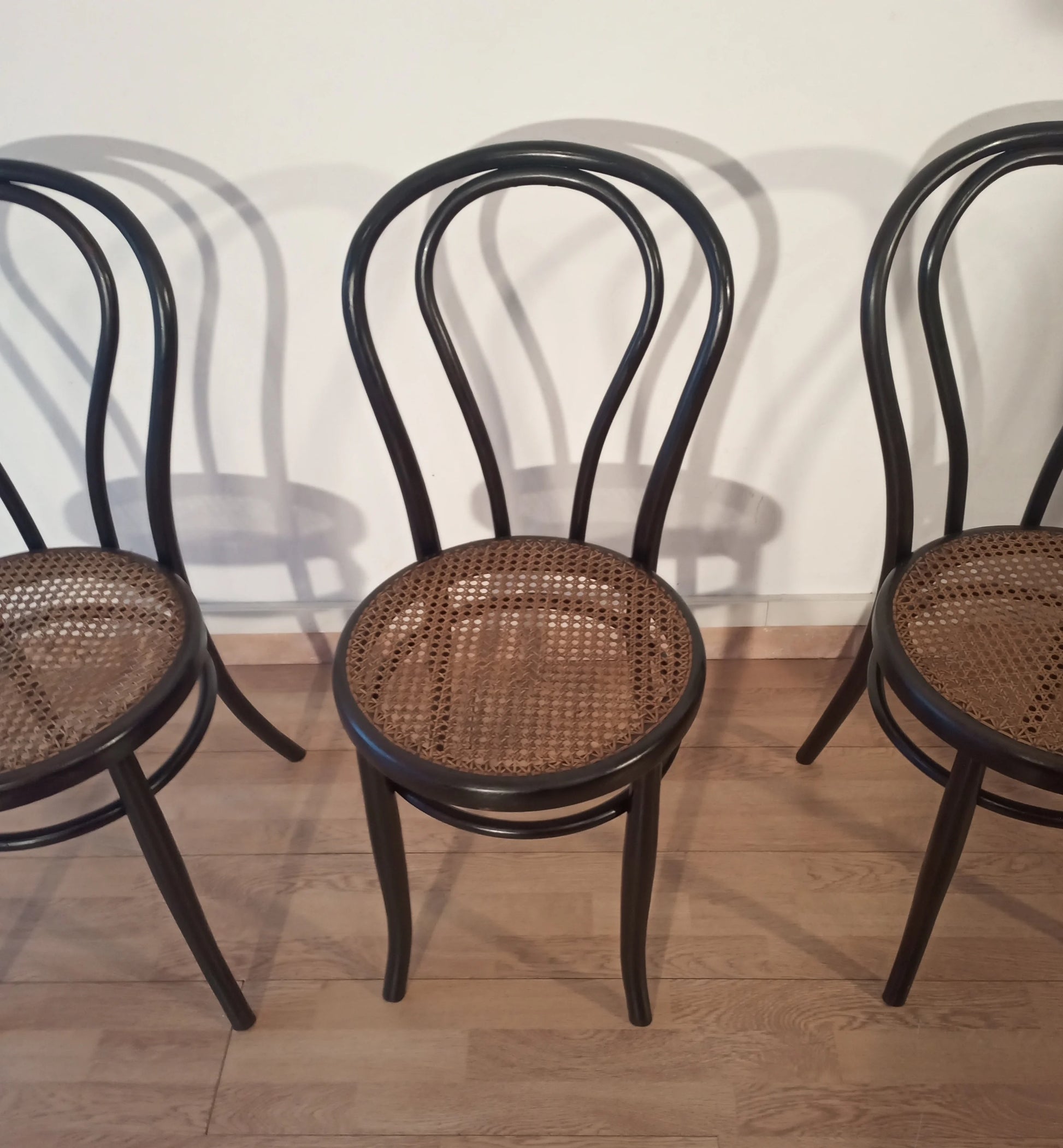 Classic Thonet Italia 4-piece bentwood dining chairs with woven cane seats