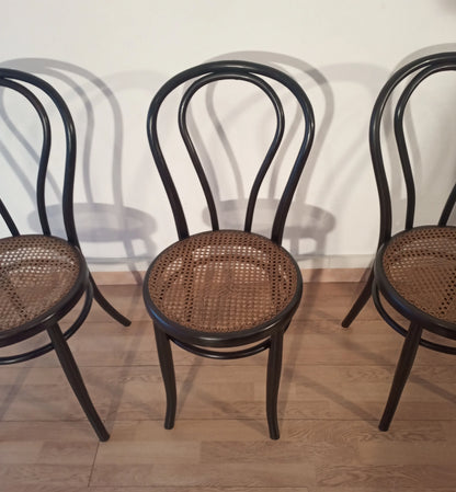 Classic Thonet Italia 4-piece bentwood dining chairs with woven cane seats