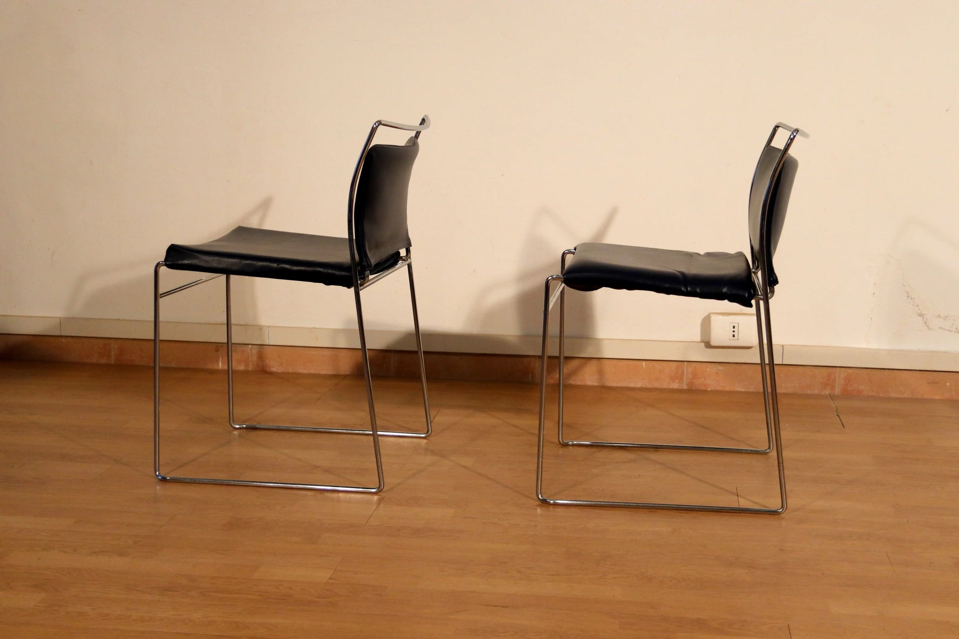 Two black leather Tulu chairs with chromed metal frame by Kazuhide Takahama for Simon Gavina, 1970s